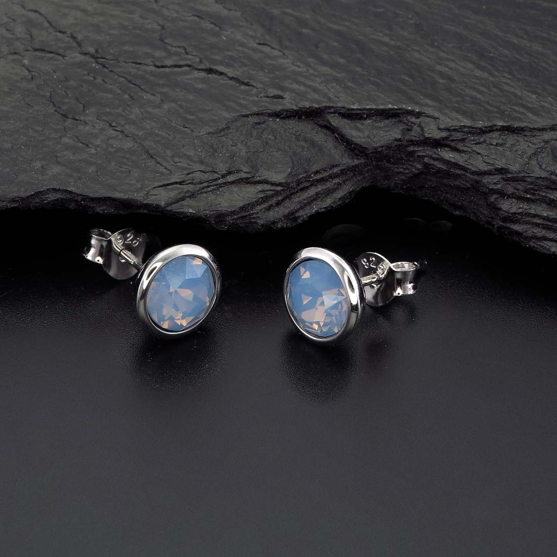 Air Blue Opal Swarovski Stud Earrings Sterling Silver on rock
