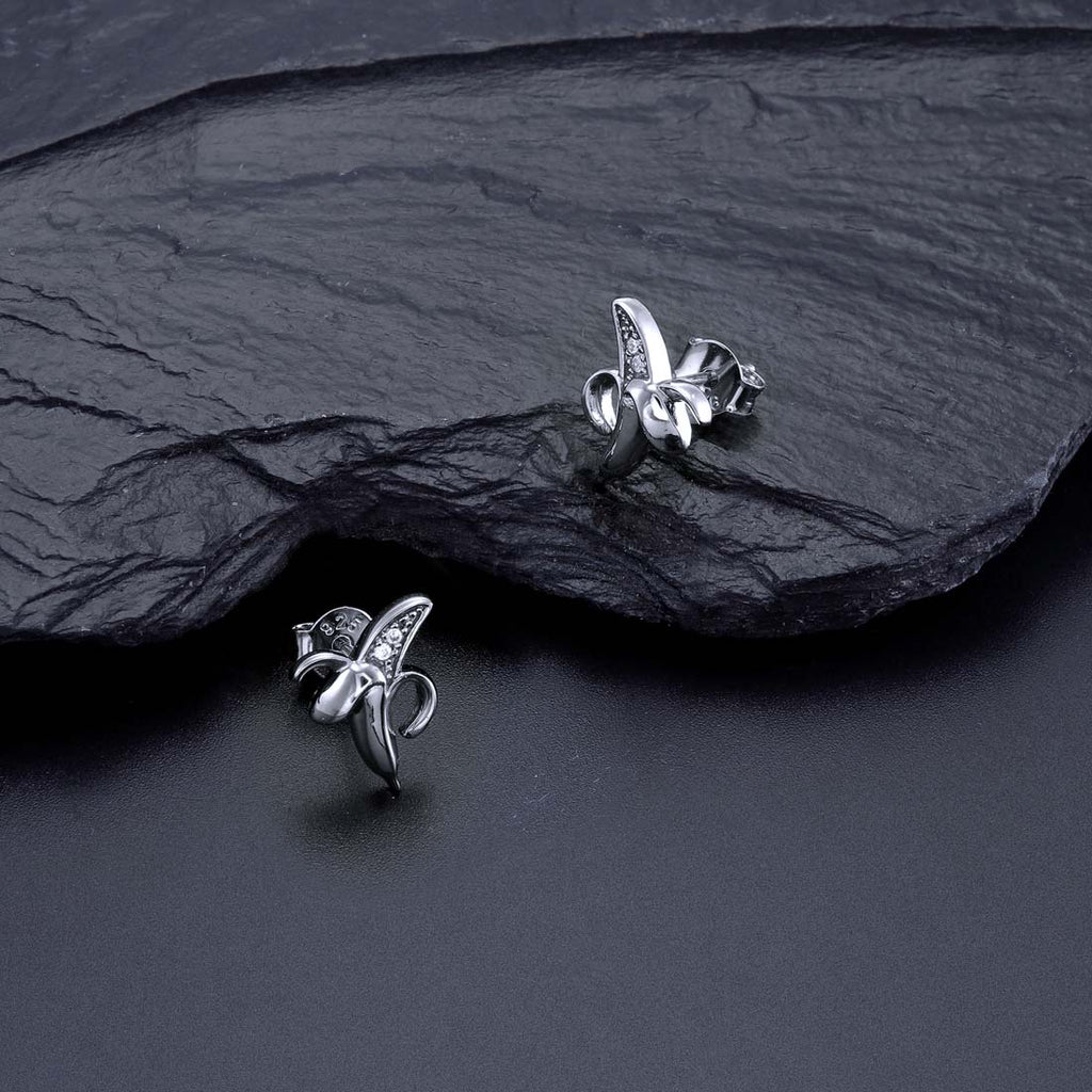 Banana Stud Earrings with Cubic Zirconia in Sterling Silver on rocks