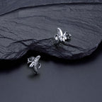 Banana Stud Earrings with Cubic Zirconia in Sterling Silver on rocks