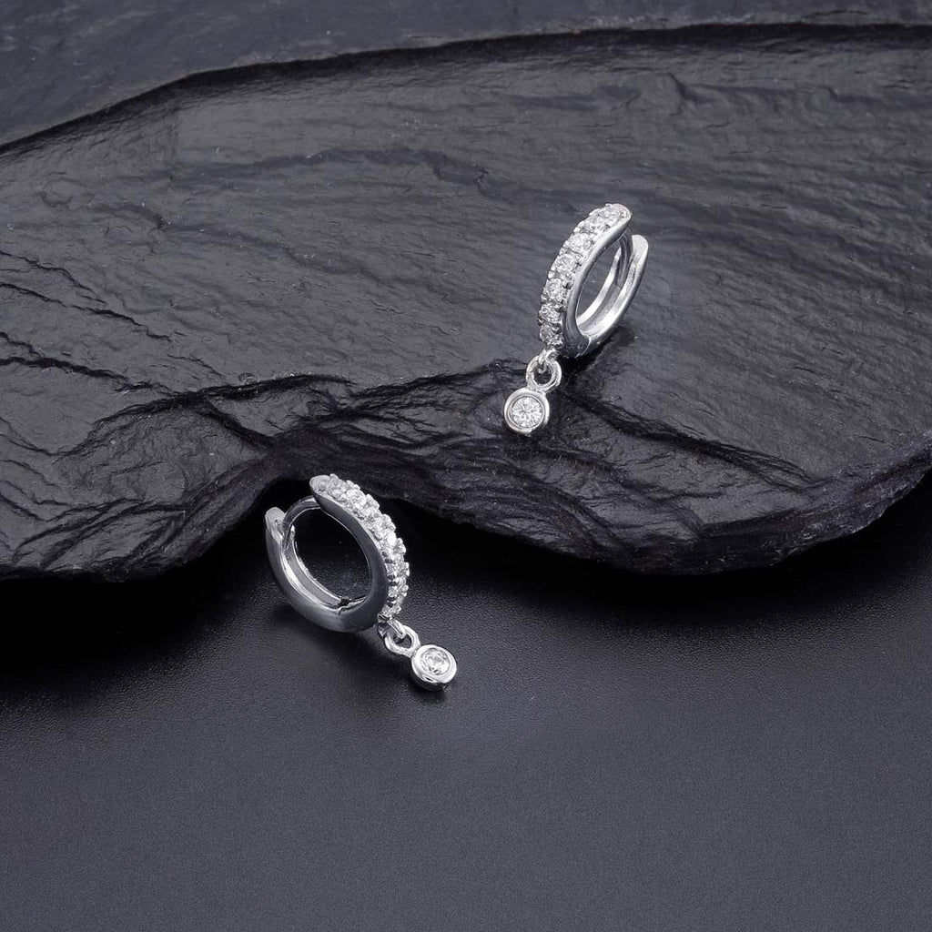Zirconia Drop Hoop Earrings with Cubic Zirconia in Sterling Silver on rocks