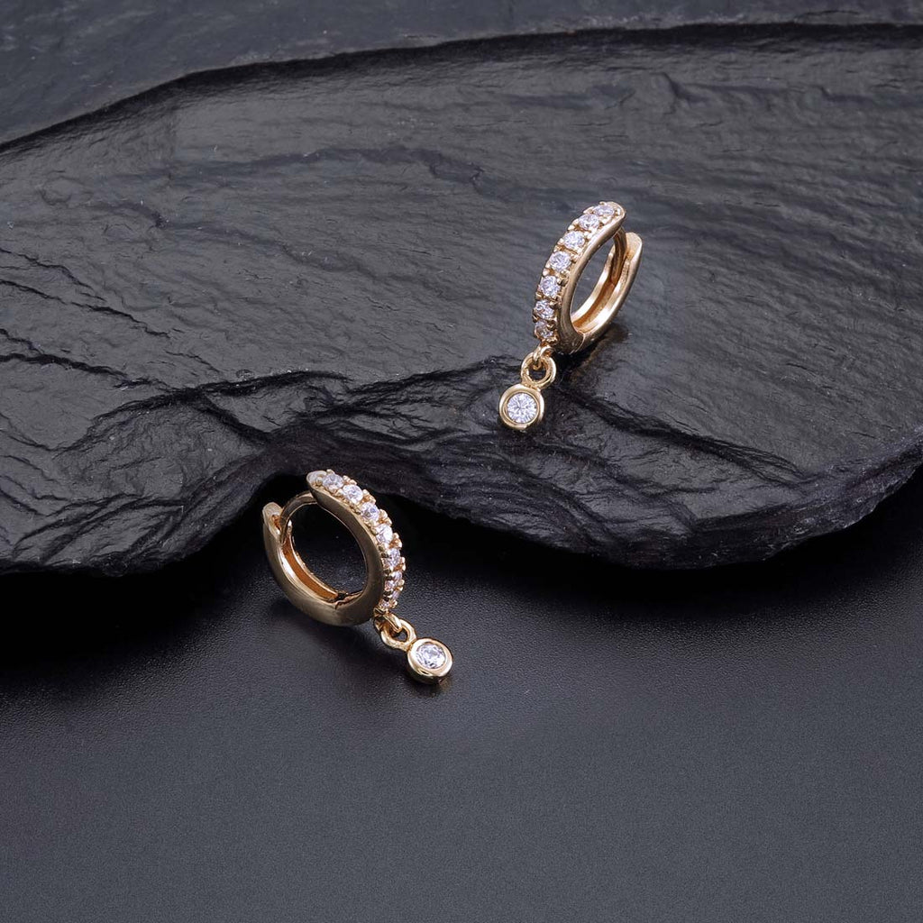 Zirconia Drop Gold Hoop Earrings Cubic Zirconia in Sterling Silver on rocks