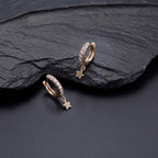 Star Drop Gold Hoop Earrings Cubic Zirconia in Sterling Silver on rocks