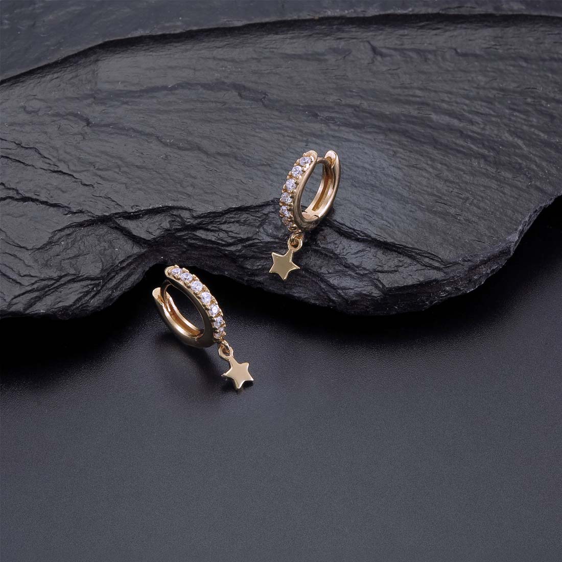 Star Drop Gold Hoop Earrings Cubic Zirconia in Sterling Silver on rocks