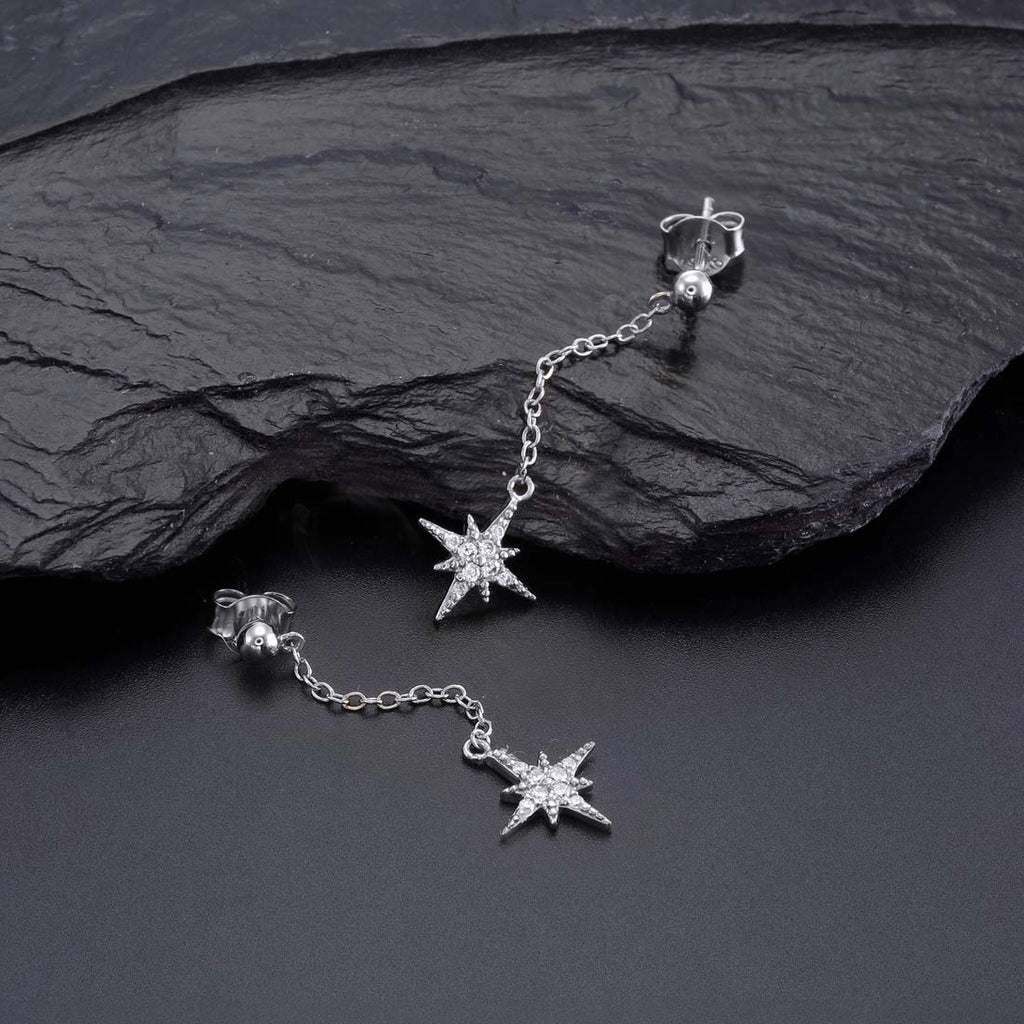 Long Star Drop Earrings Cubic Zirconia in Sterling Silver on rocks