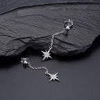 Long Star Drop Earrings Cubic Zirconia in Sterling Silver on rocks