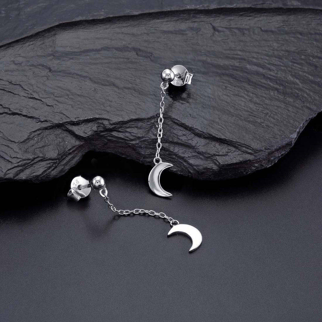 Dangle Crescent Moon Earrings Cubic Zirconia in Sterling Silver on rocks