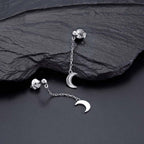 Dangle Crescent Moon Earrings Cubic Zirconia in Sterling Silver on rocks