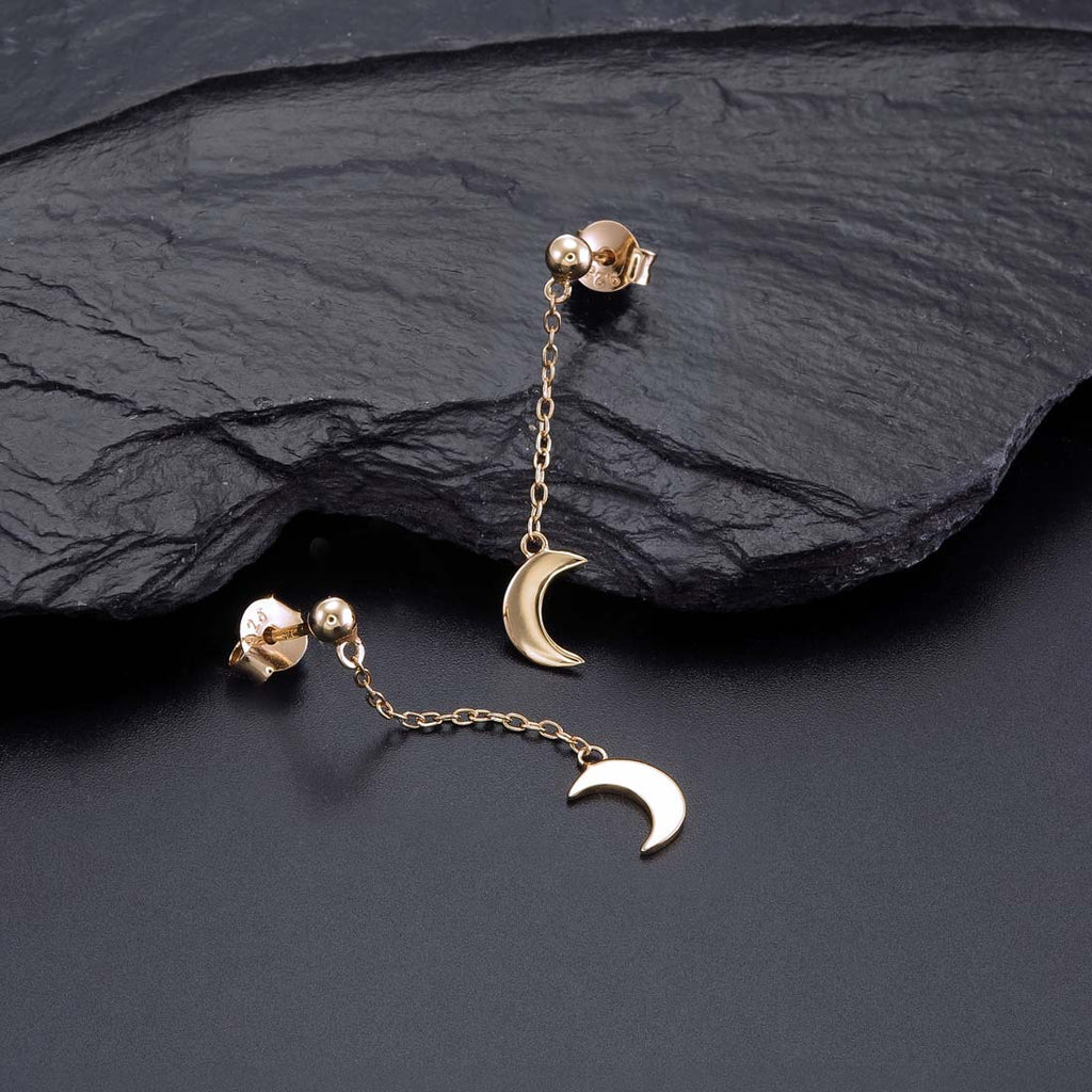 Gold Dangle Crescent Moon Earrings Cubic Zirconia in Sterling Silver on rocks