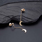 Gold Dangle Crescent Moon Earrings Cubic Zirconia in Sterling Silver on rocks