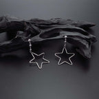 Hanging Star Earrings in Sterling Silver on rocks