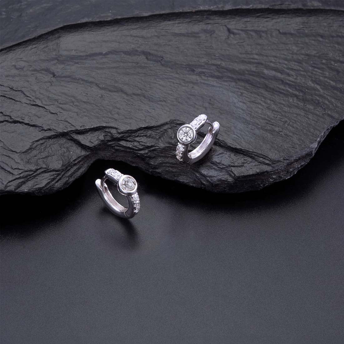 Bezel Zirconia Hoop Earrings Cubic Zirconia in Sterling Silver on rocks