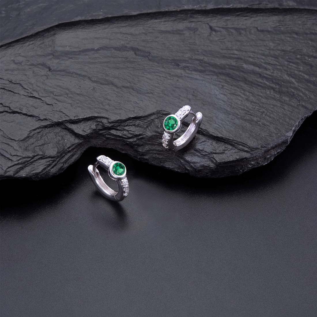 Bezel Green Zirconia Hoop Earrings Cubic Zirconia in Sterling Silver on rocks