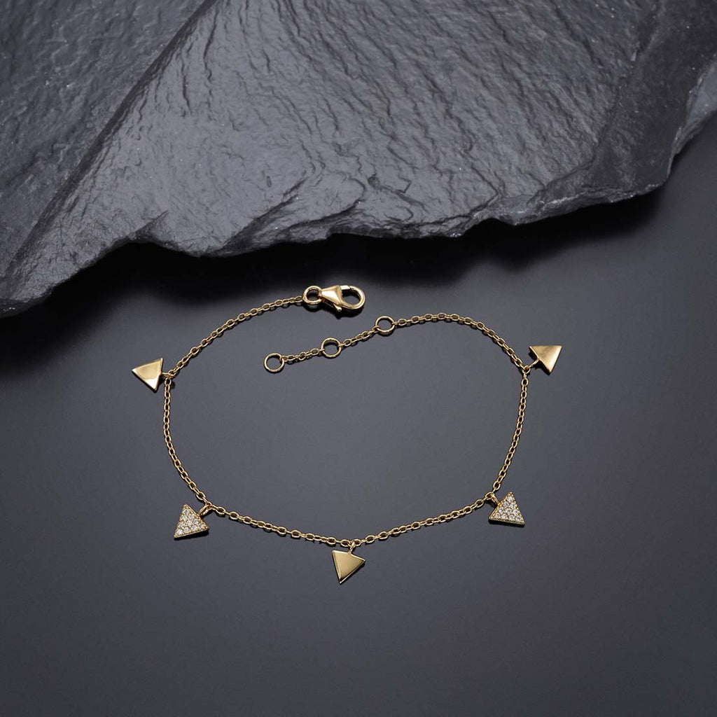 Triangle Charm Bracelet Gold Plated Sterling Silver & Cubic Zirconia near black rock