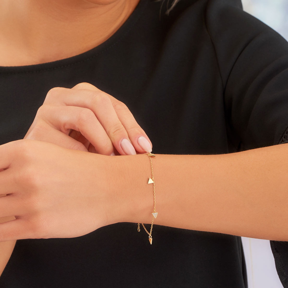 Closeup of Female Model Wearing Triangle Charm Bracelet Gold Plated Sterling Silver & Cubic Zirconia