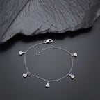 Diamonte Charm Bracelet for Women in Sterling Silver & Cubic Zirconia near black rock