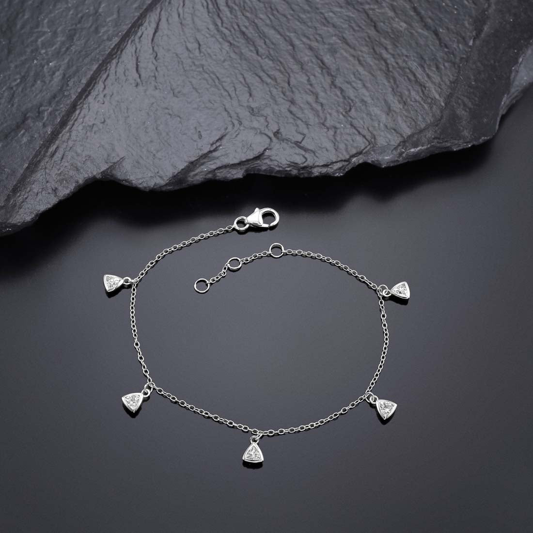 Diamonte Charm Bracelet for Women in Sterling Silver & Cubic Zirconia near black rock