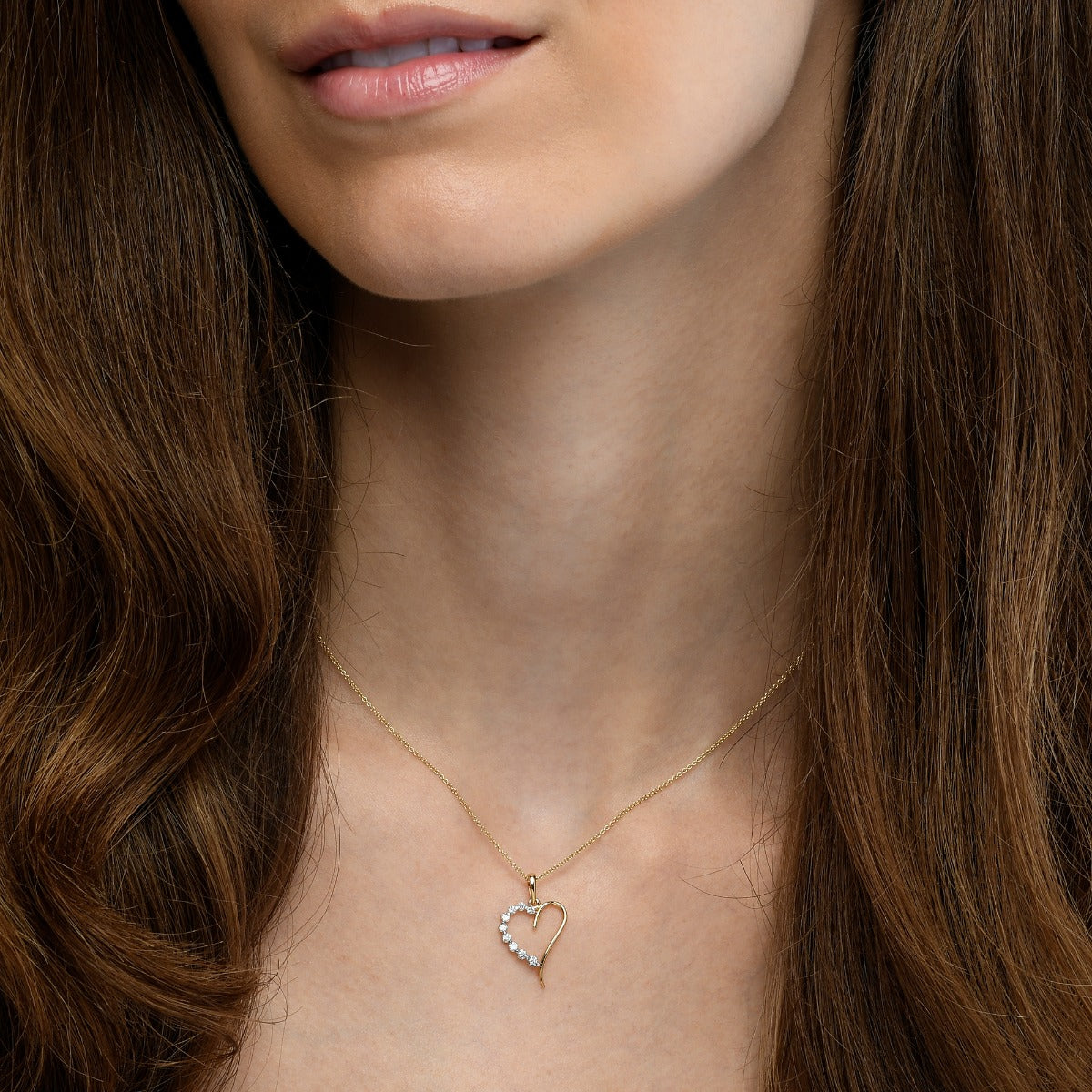 Heart shape 0.20ct diamond pendant in 9K yellow gold