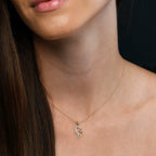 Interlocking heart shape 0.12ct diamond pendant in 9K yellow gold