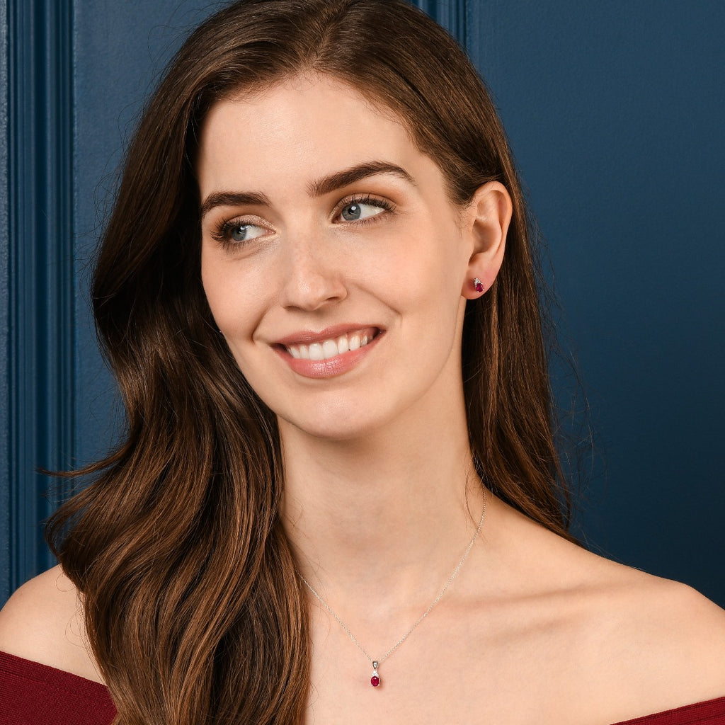 Oval Ruby Stud Earrings with 0.10ct Diamonds 9K White Gold