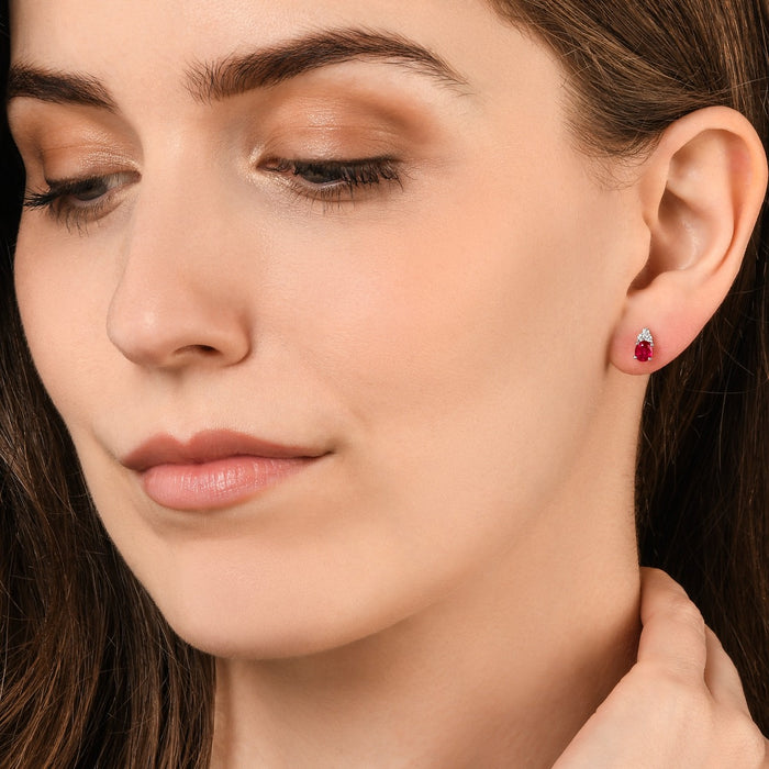 Oval Ruby Stud Earrings with 0.10ct Diamonds 9K White Gold