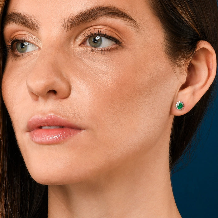 Oval Emerald Stud Earrings with 0.23ct Diamond halo 18K White Gold