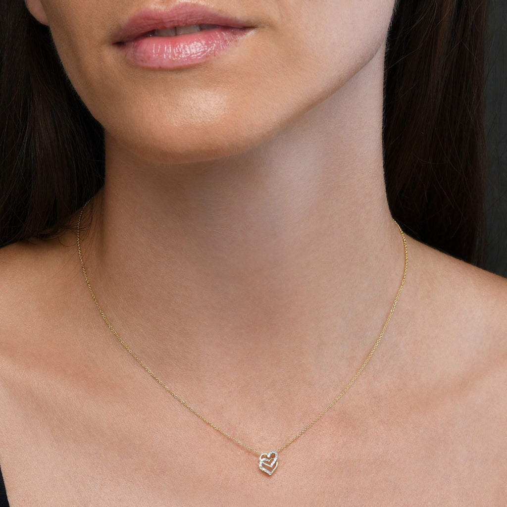 Interlocking heart shape 0.07ct diamond pendant in 9K yellow gold