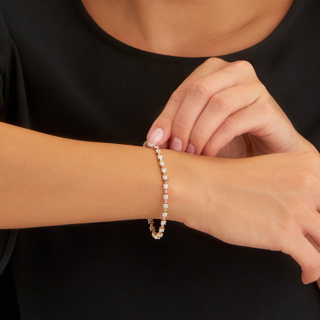 Female Model Wearing Flower Diamond Bracelet 1.50ct Diamonds in 9K Yellow Gold closeup