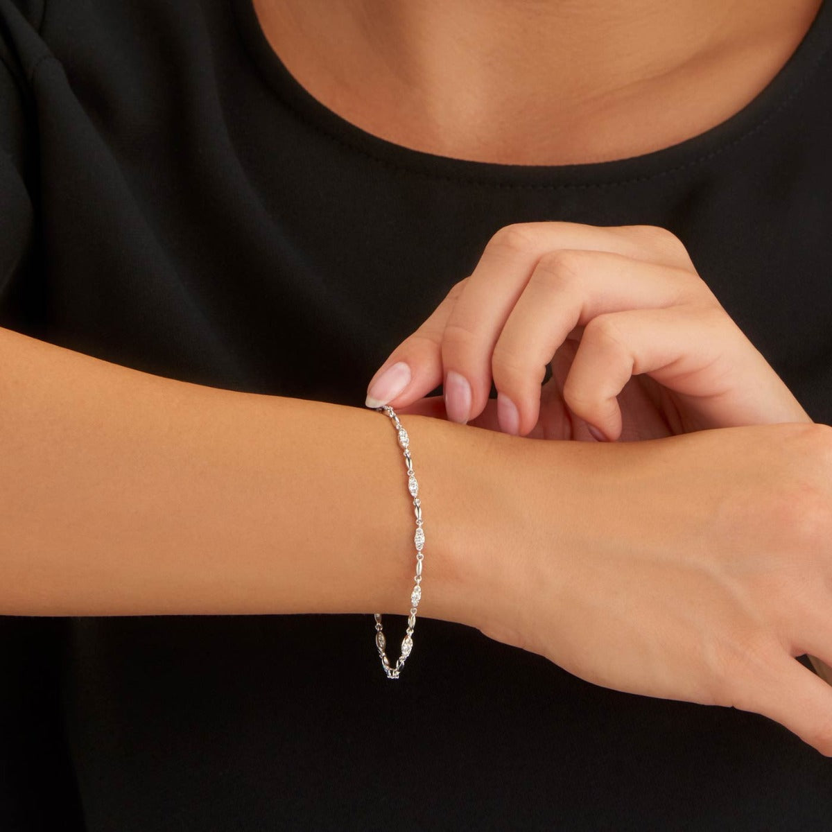 Female Model Wearing Trilogy Diamond Bracelet 1ct Diamonds in 9K White Gold closeup