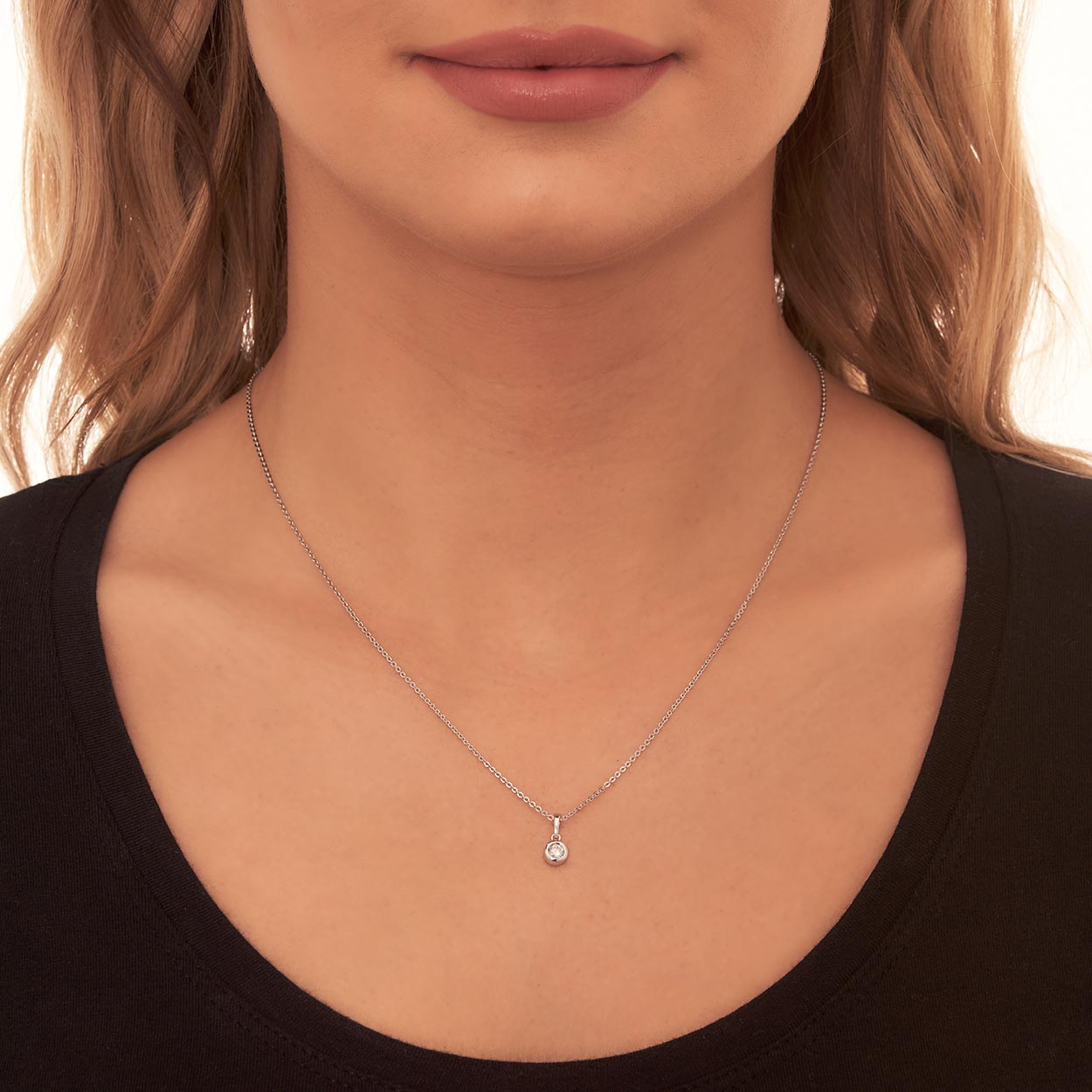 Solitaire 0.20ct bezel set round diamond pendant in 18K white gold