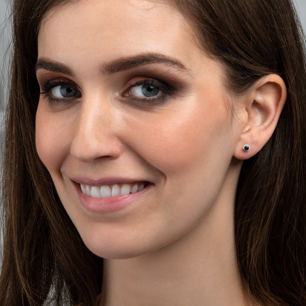 Small Blue sapphire halo stud earrings in 9K white gold