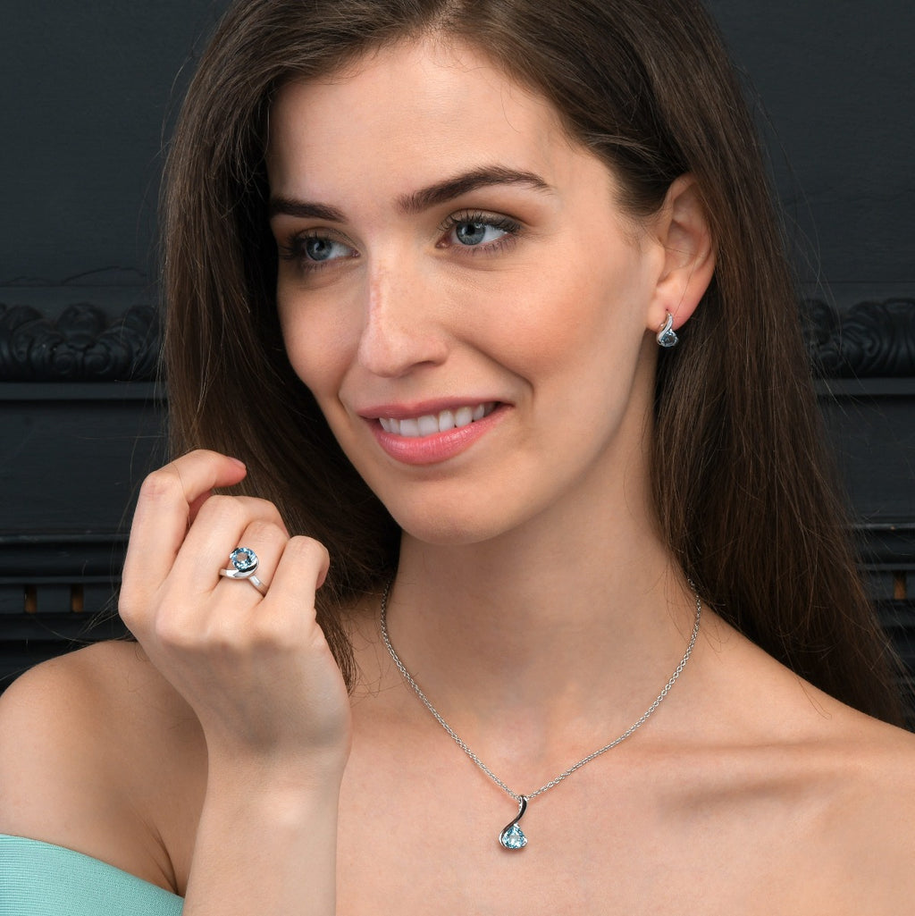 Blue Topaz Pear Shaped Earrings in Sterling Silver