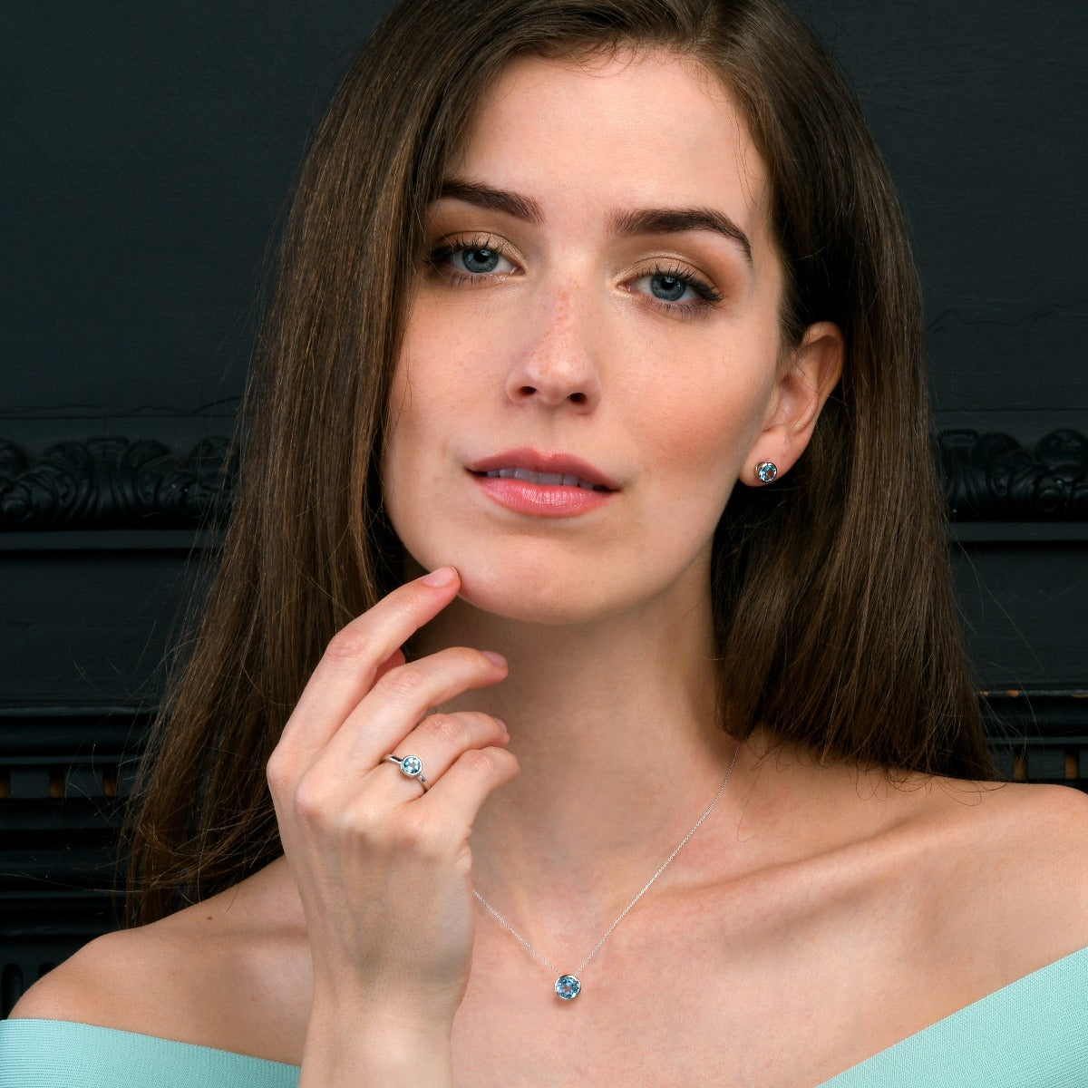 Bezel Set Blue Topaz Stud Earrings in Sterling Silver