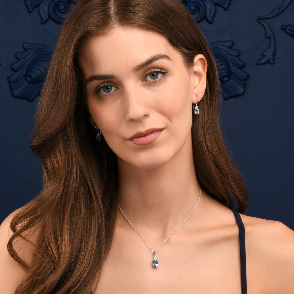 Oval Shaped Blue Topaz Pendant Necklace in Sterling Silver