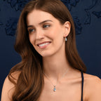 Oval Shaped Blue Topaz Drop Earrings in Sterling Silver