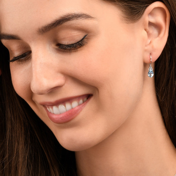 Oval Shaped Blue Topaz Drop Earrings in Sterling Silver