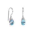 Oval Shaped Blue Topaz Drop Earrings in Sterling Silver