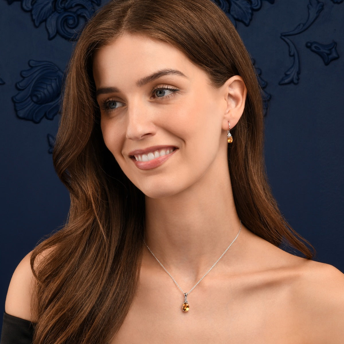 Oval Shaped Citrine Drop Earrings in Sterling Silver