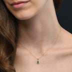 4mm x 6mm pear shaped Emerald and 0.05ct Diamond pendant necklace in 9K yellow gold