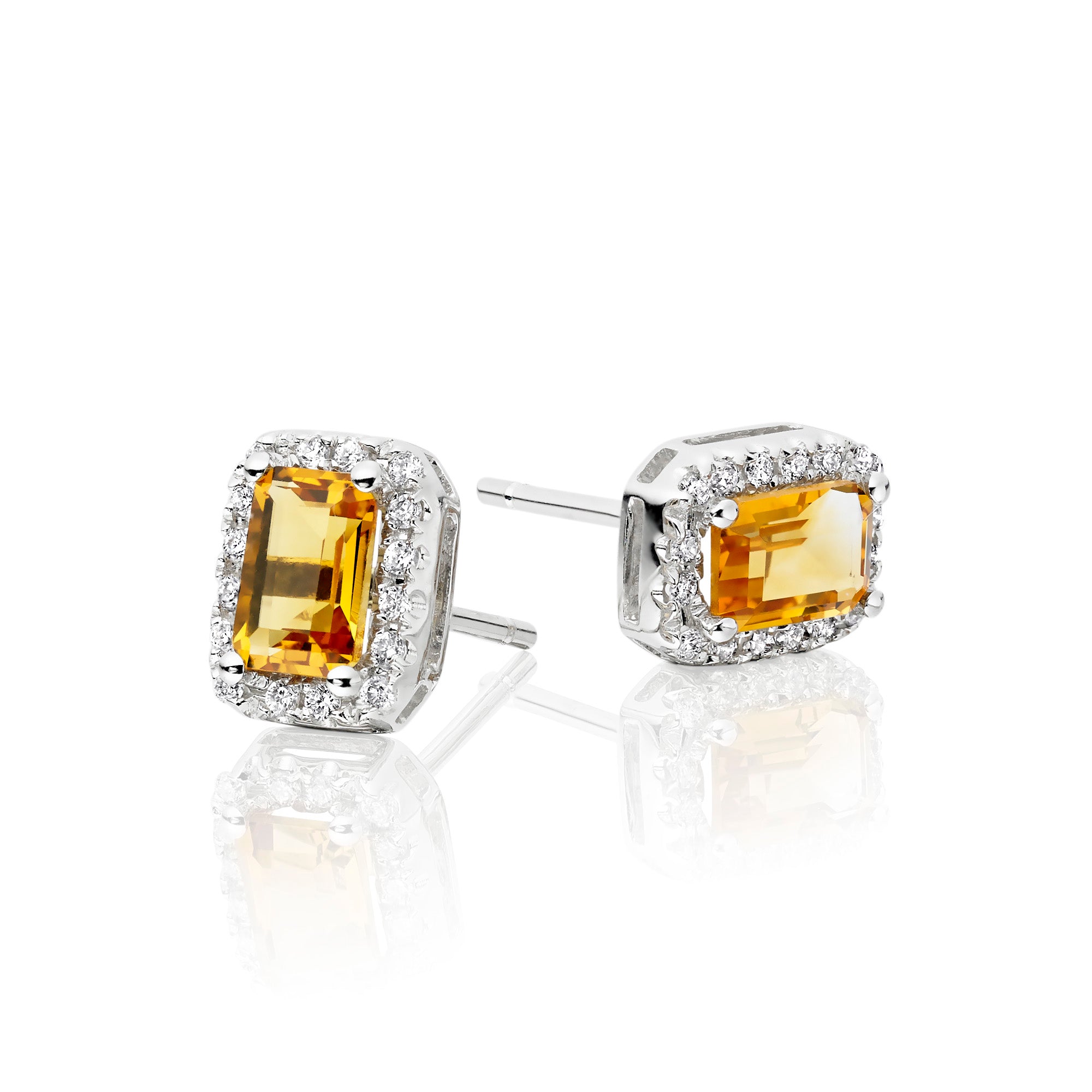 4mm x 6mm Citrine and 0.15ct diamond stud earrings in 9K white gold