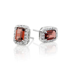 4mm x 6mm Garnet and 0.15ct diamond stud earrings in 9K white gold