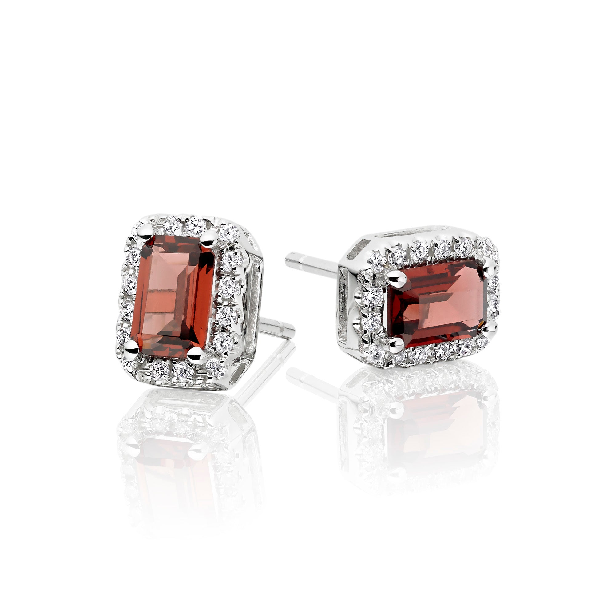 4mm x 6mm Garnet and 0.15ct diamond stud earrings in 9K white gold