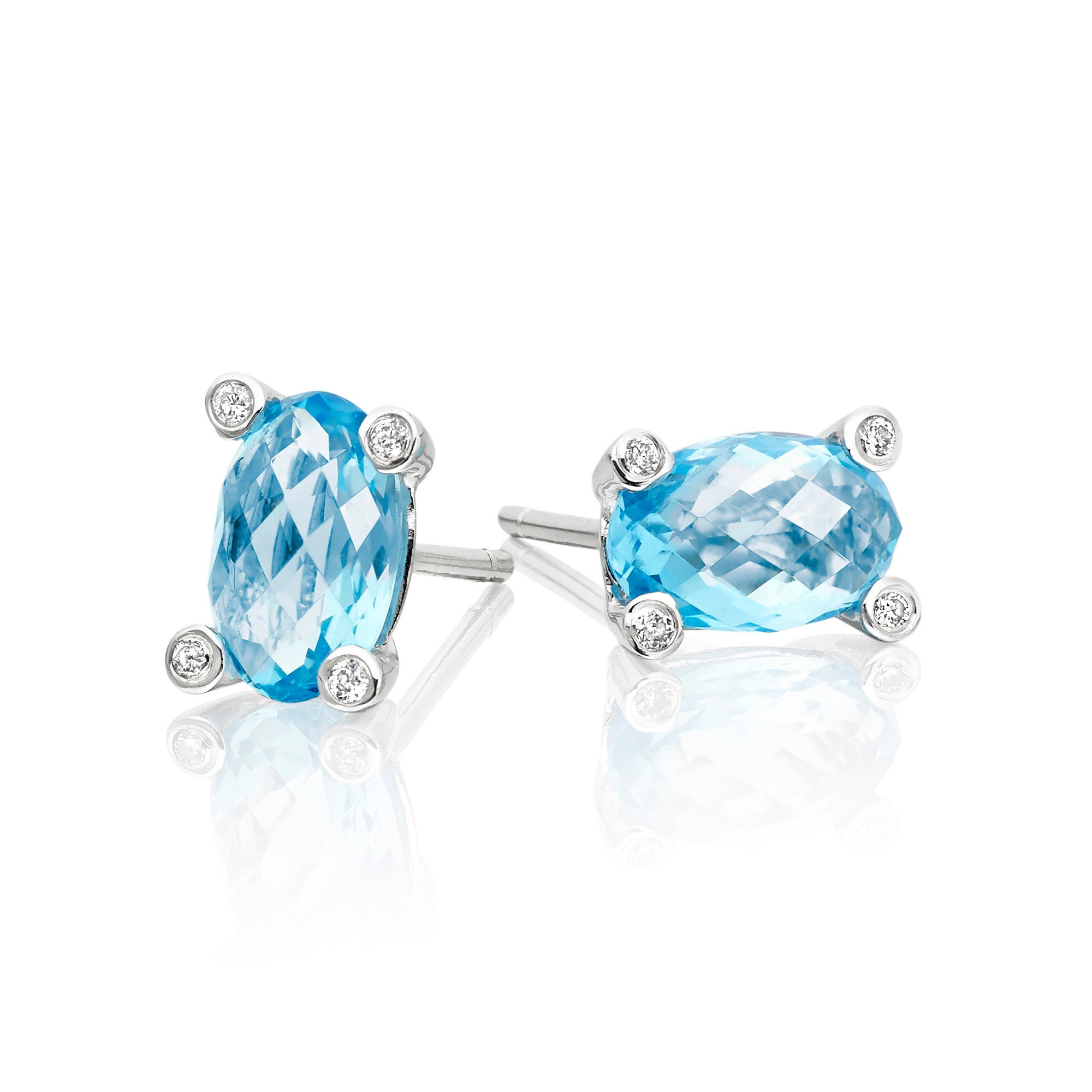 5mm x 8mm Blue Topaz and 0.05ct diamond stud earrings in 9K white gold