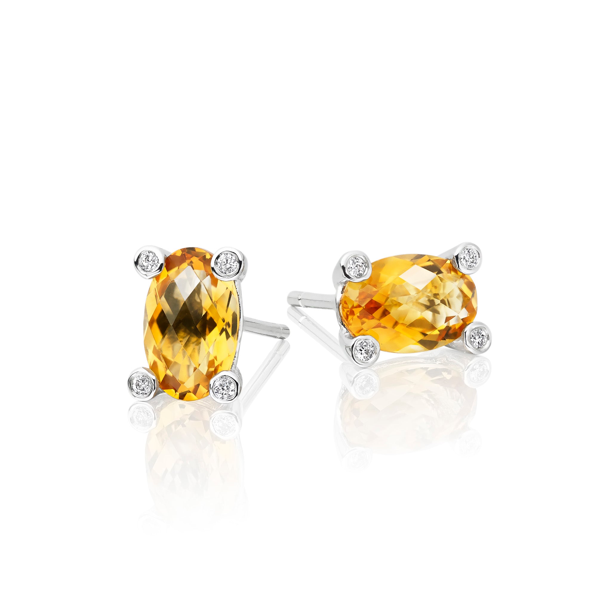 5mm x 8mm Citrine and 0.05ct diamond stud earrings in 18K white gold