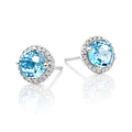 6mm Blue Topaz and 0.12ct diamond stud earrings in 18K white gold