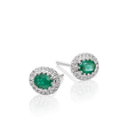 Oval Emerald and 0.11ct diamond stud earrings in 9K white gold