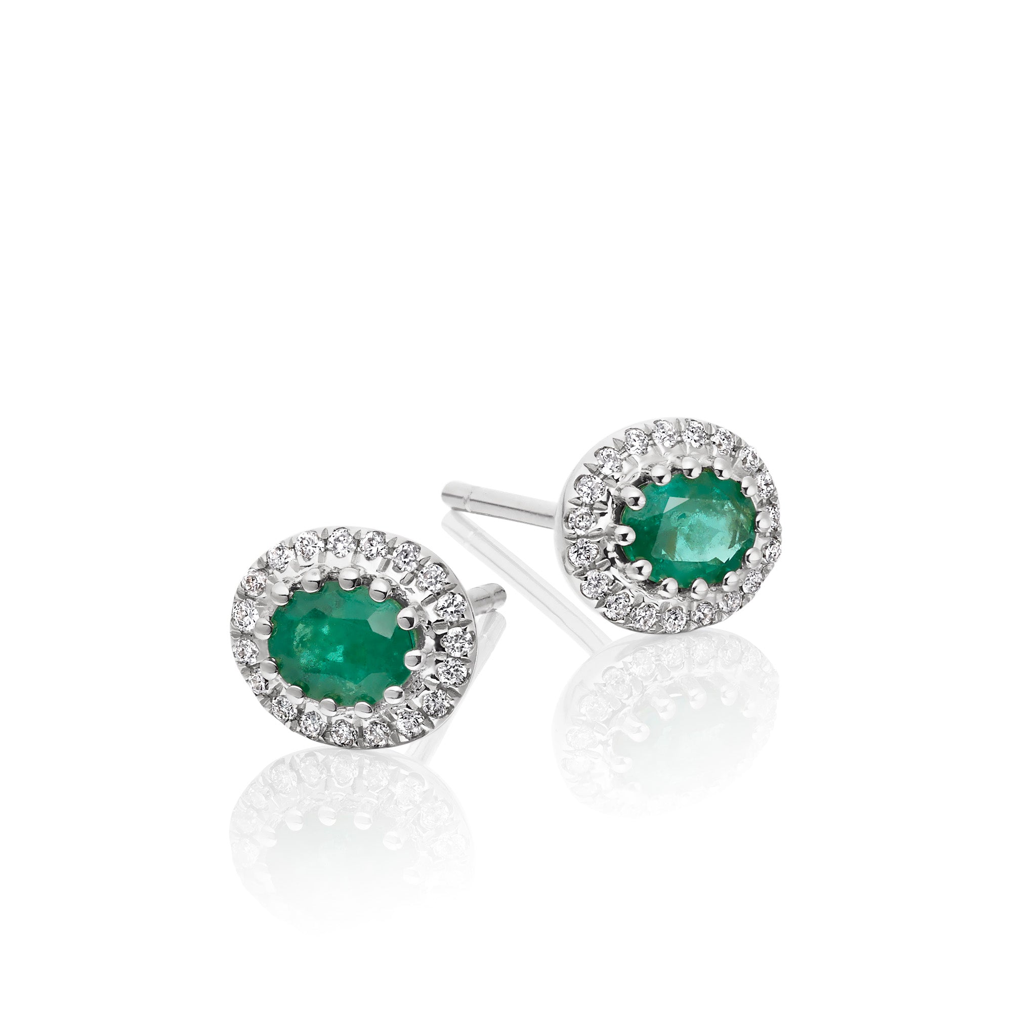 Oval Emerald and 0.11ct diamond stud earrings in 9K white gold