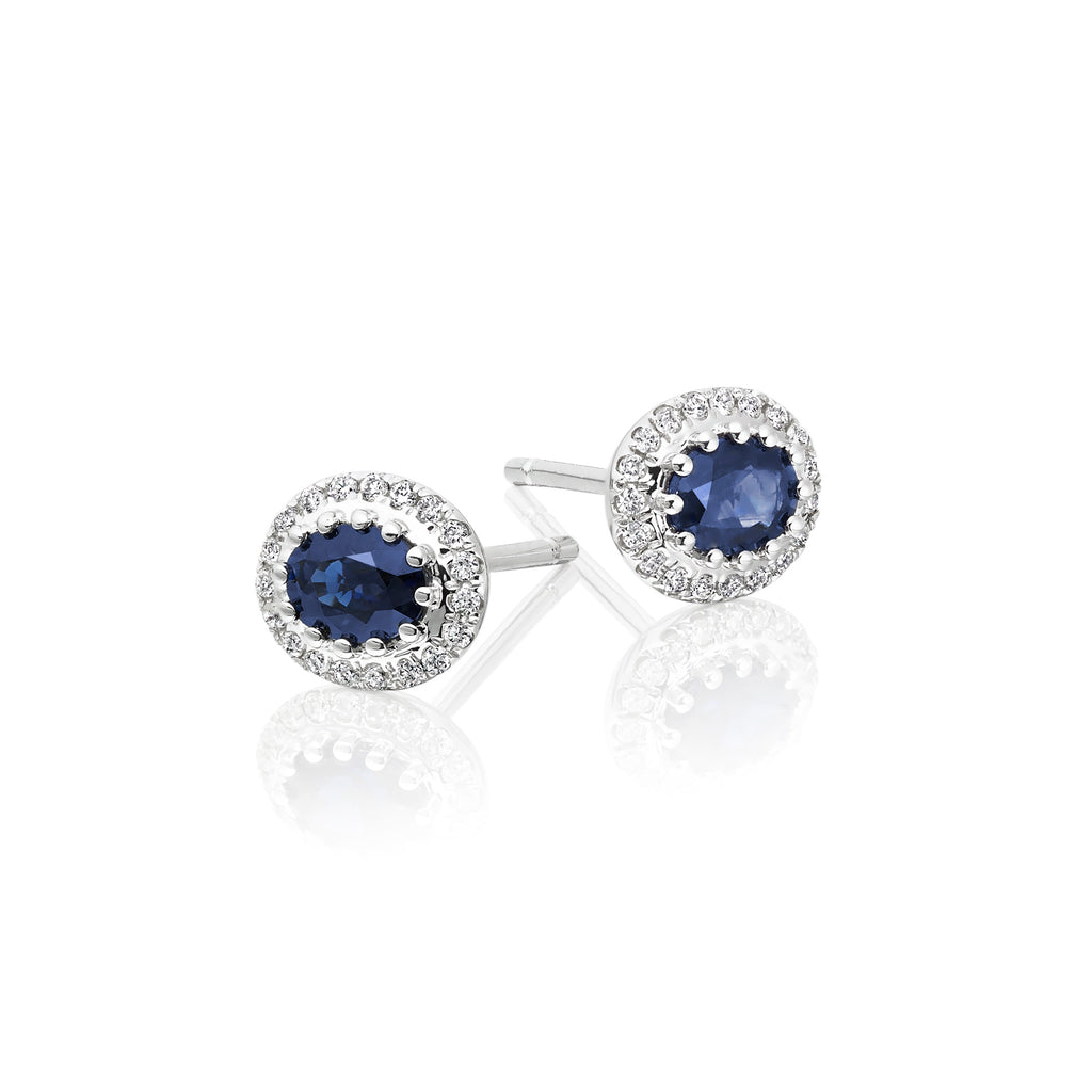 Oval Sapphire and 0.11ct diamond stud earrings in 18K white gold