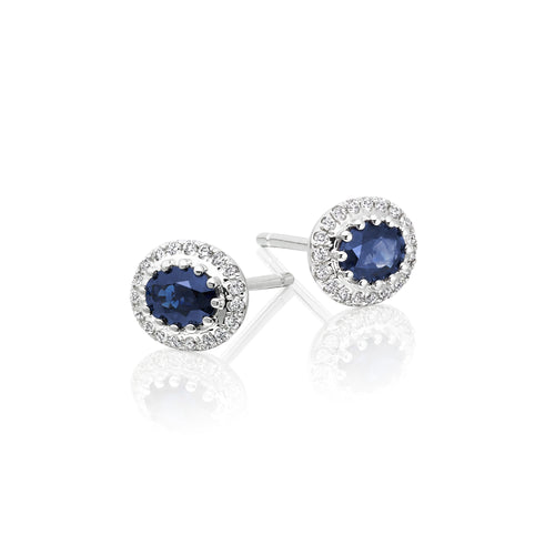 Oval Sapphire and 0.11ct diamond stud earrings in 18K white gold