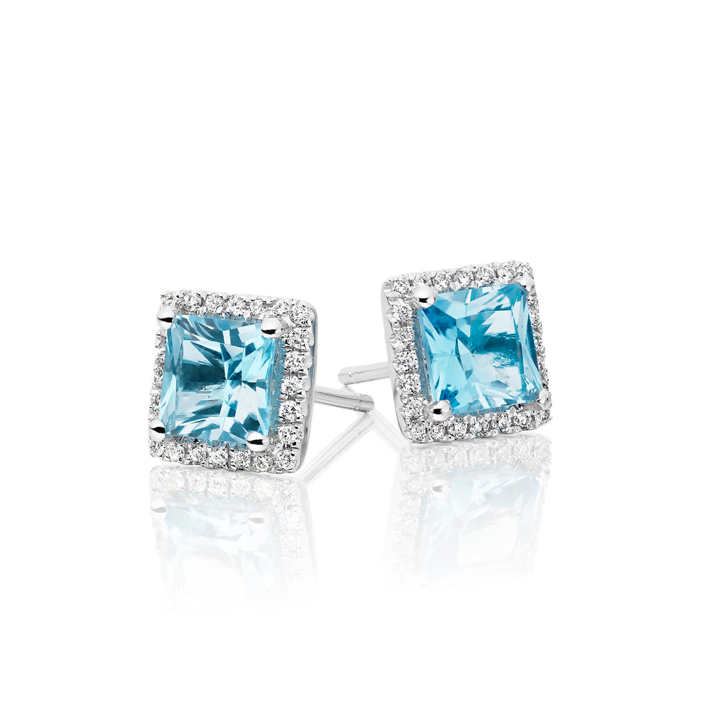 5mm x 5mm Blue Topaz and 0.19ct diamond stud earrings in 9K white gold
