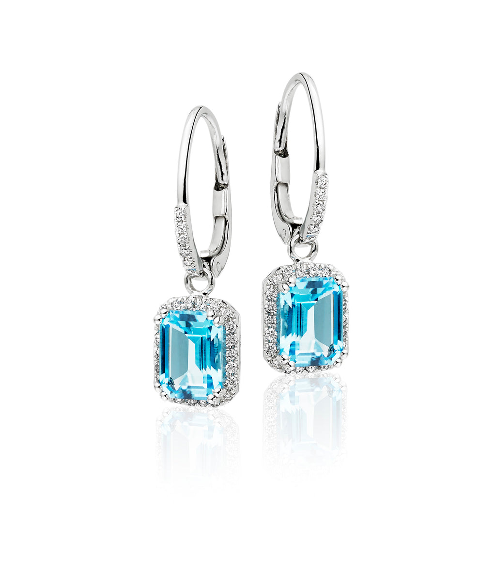 5mm x 7mm Blue Topaz and 0.20ct diamond earrings in 9K white gold